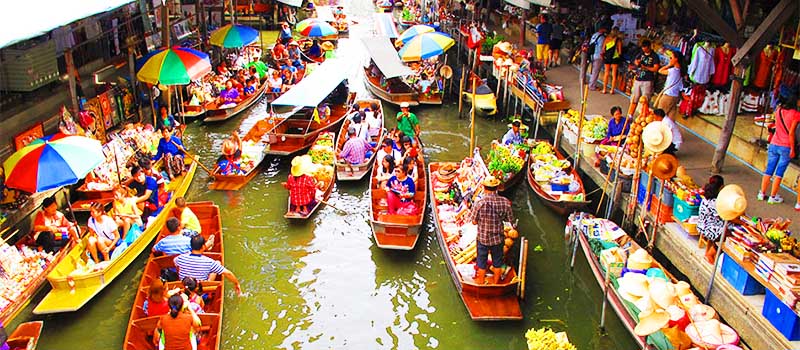 Boats packed with produce at the Damnoen Saduak floating market west of Bangkok Boats packed with produce at the Damnoen Saduak floating market west of Bangkok