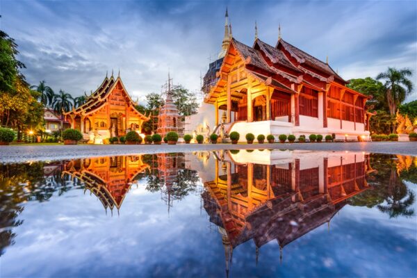 A Lanna temple reflected in its pond in the Chiang Mai old city A Lanna temple reflected in its pond in the Chiang Mai old city