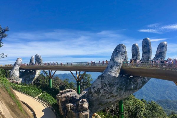 The Golden Bridge carried on two stone hands at Ba Na Hills above Da Nang The Golden Bridge carried on two stone hands at Ba Na Hills above Da Nang
