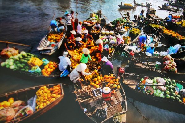 Boats rafted together at dawn on the Cai Rang floating market near Can Tho Boats rafted together at dawn on the Cai Rang floating market near Can Tho